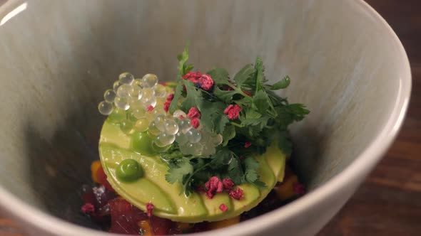 Chef is Making Seafood Tartar Poke Bowl Salmon Avocado Tuna Atappetizer on Professional Kitchen alt