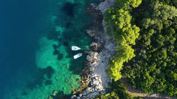 Aerial view on rocks and forest. Vacation and adventure. Rocks and turquoise water alt