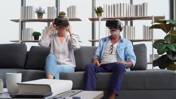 Senior couple having fun with virtual reality glasses, Happy elderly technology concepts