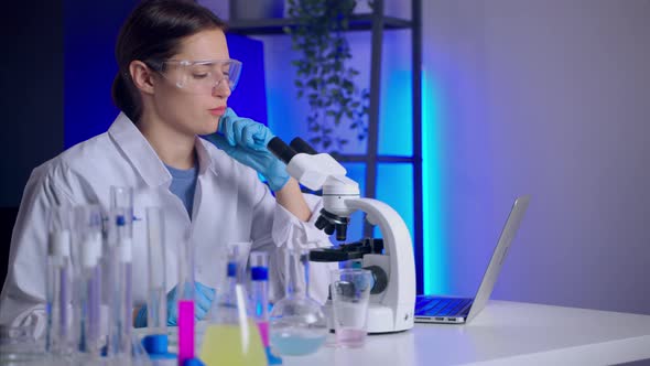 Woman Researcher Thinking Over the Results of Experiment alt