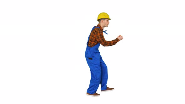 Dancing Young Engineer with Helmet After Work on White Background. alt