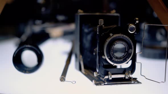 Old Movie Camera Stand on the Highlighted Table 2 alt