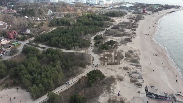 AERIAL: Beach Paths in Melnrage near Klaipeda Port Terminal on a Cloudy Day alt