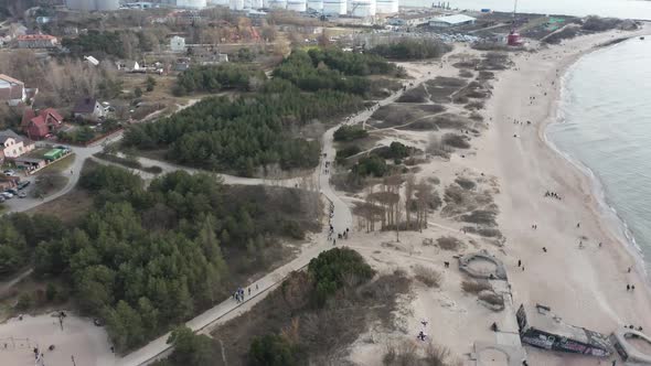 AERIAL: Beach Paths in Melnrage near Klaipeda Port Terminal on a Cloudy Day