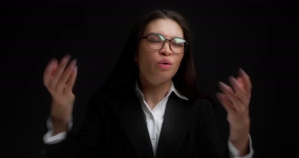 Business Woman Waves Her Hands Near Her Face She is Very Hot alt
