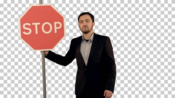 A businessman holding a stop sign on laptop, Alpha Channel