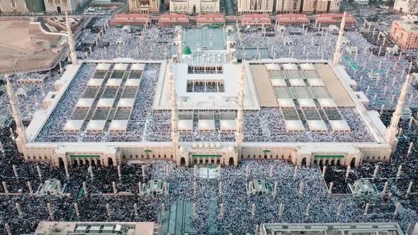Huge muslim crowd praying Eid Prayer in the Masjid e Nabawi mosque alt