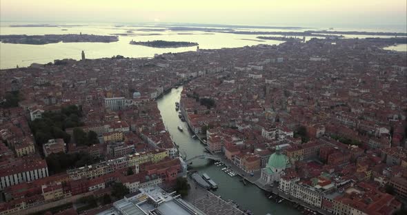 Wide aerial shot of Venice and Chiesa di San Simeone Piccolo from above at dusk alt