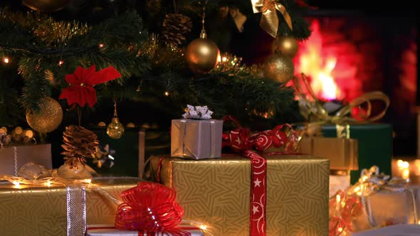 Christmas Gifts near Christmas Tree and Fireplace