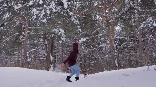 Slow Motion Woman Throwing Hot Water in Cold Air Warm Water Turning to Steam alt