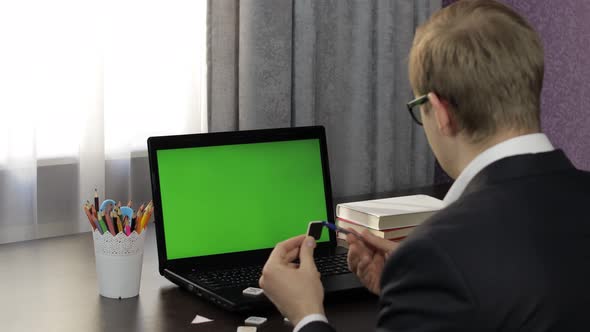 Man Teacher Making Online Video Call on Laptop. Green Screen. Distance Education alt