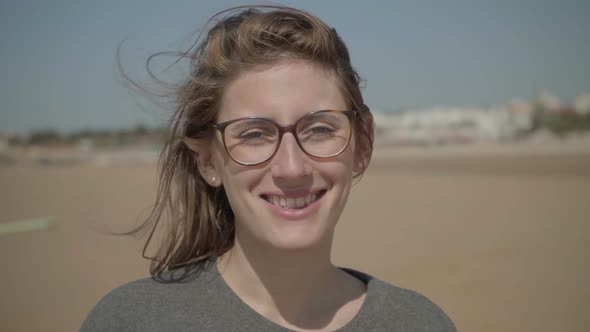 Beautiful Young Woman in Eyeglasses Looking at Camera alt
