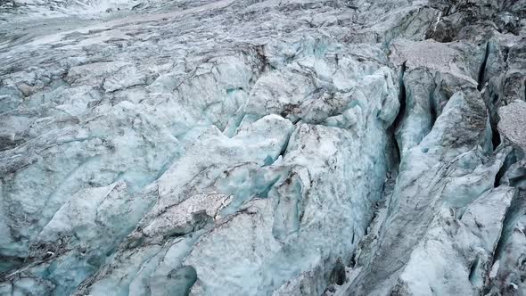 Aerial shot of an melting ice mass in a alpin Galcier in Europe alt