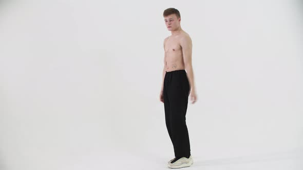 Dancing Popping  Young Shirtless Man Freestyle Dancing on Cyclorama alt