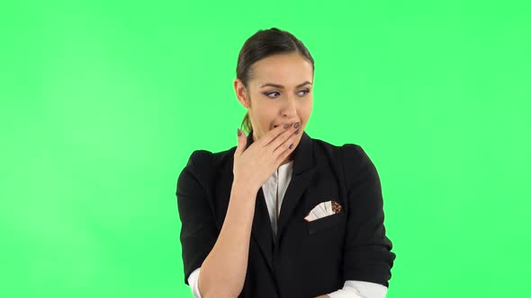 Girl Listens Carefully To Boring Information and Looks Around. Green Screen alt