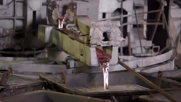 Close-up, the Hot Metal Is Poured From the Furnaces Special Baths. Aluminum, the Material That Is alt