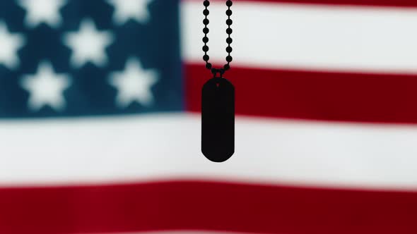Military Tag with the Flag of the United States of American Out of Focus alt