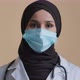 Portrait of Arabian Muslim Woman Nurse Doctor Wear Hijab Protective Medical Mask Posing with - VideoHive Item for Sale