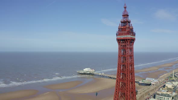 Aerial footage, drone view , of the famous Blackpool Tower and beach from the sky on a beautiful Sum alt