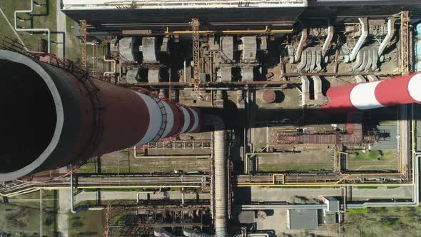 Aerial Top Down Drone View of Large Red and White Chimney Without Smoke at Sunny Day
