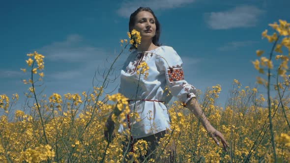 Ukrainian Woman in Ethnic Dress in the Field