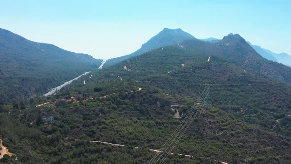 Cars travelling on highway that winds through the mountains towards Nicosia Cyprus alt
