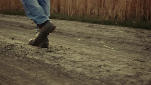 Man Farmer Legs in Shoes Passing Farmland Rural Road alt
