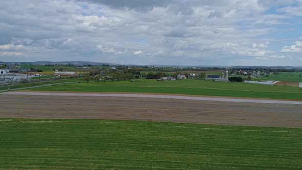 Aerial View of Amish Farmlands and Homesteads With Amish Playing Volleyball alt