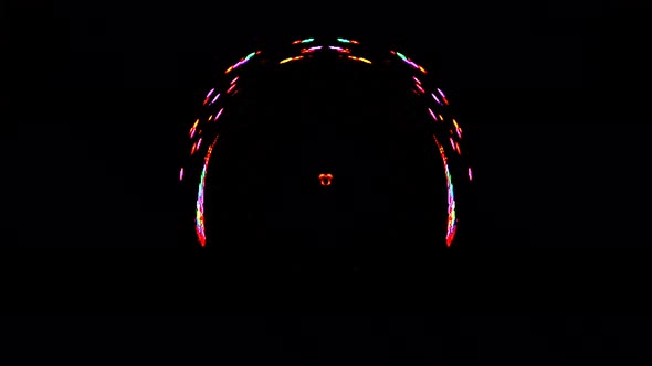 animated round shape of multicolor flashing lights, on a black background alt