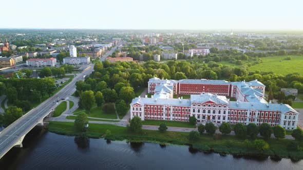 Aerial View of Jelgava City Panorama and Lielupe River in Latvia, Zemgale at Sunset 4K Dron Shot alt