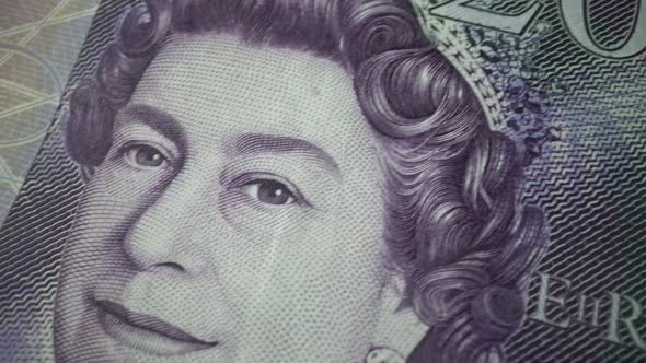 Fifty British Pound paper banknote in close up macro view dolly shot. alt