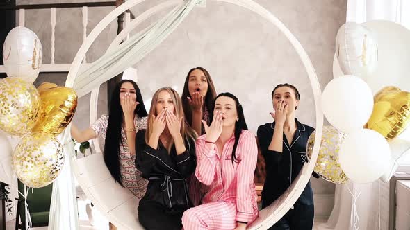 Group of Smiling Pretty Girls Laughing and Smiling in Pajamas