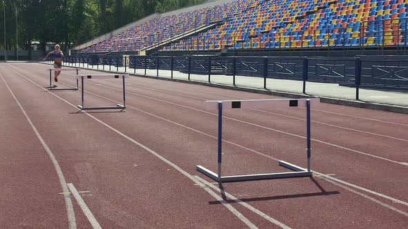 Sportive Blonde Learning to Overcome All Difficulties on Life Path Hurdle Race alt