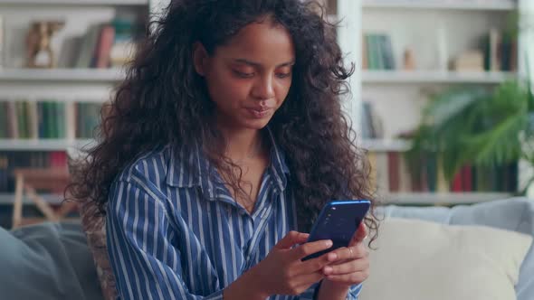 Indian Teen Girl Using Cellphone Text Messaging Chatting with Friends alt