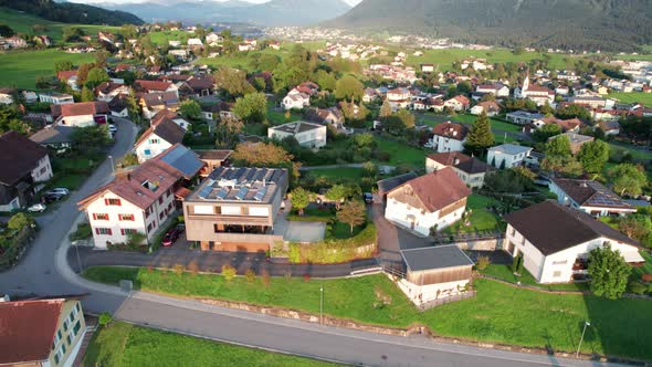 Aerial View of Liechtenstein with Houses on Green Fields in Alps Mountain Valley alt