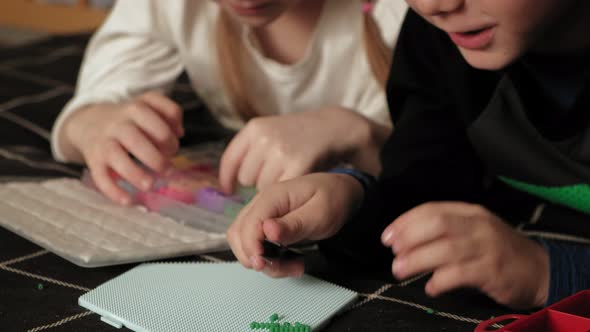 Child Plays with Perler Beads