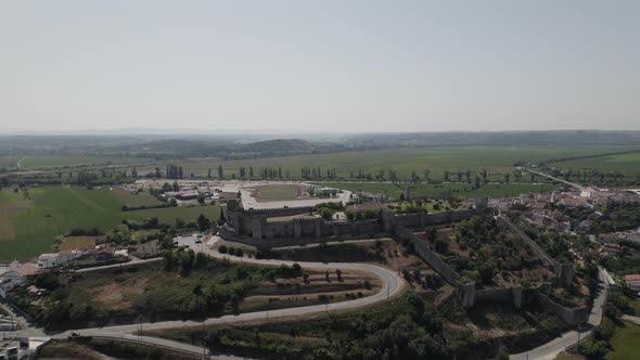 Montemor o Velho castle and surrounding countryside, Portugal. Aerial circling