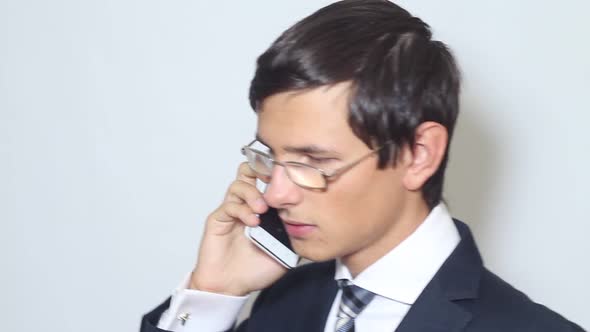 Young Businessman Talking On The Phone