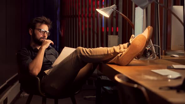 Accountant Calculate Profit. Bookkeeper Auditing Paperwork In Office Workplace. Overtime Work. alt