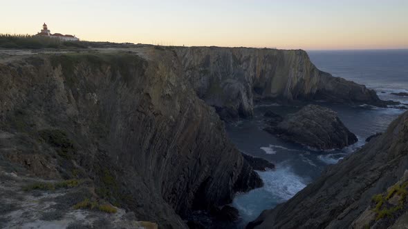 Cabo do Sardao Lighthouse Cape view at sunrise, in Portugal alt