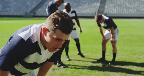 Male Rugby Player Disappointed After Losing Match in Stadium alt