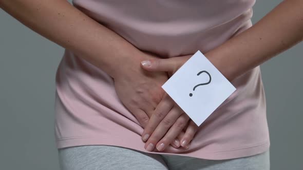 Woman With Question Mark Holding Lower Belly, Suffering From Pain, Cystitis