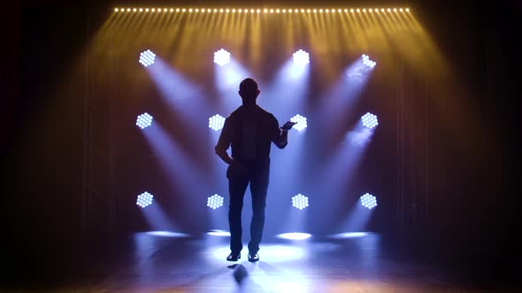 Man Dancing Latin Music, Bachata, Merengue, Salsa, Shot in a Dark Studio with Neon Lights in the alt