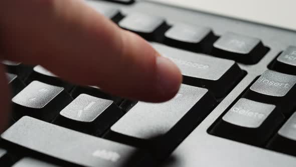 Enter button pressing on keyboard, close up alt