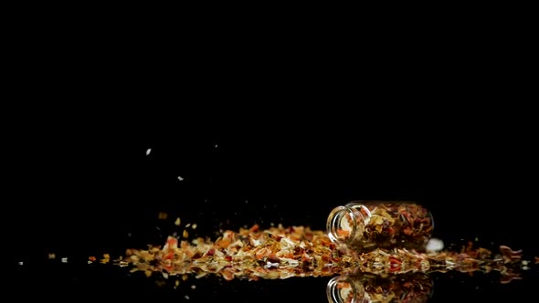 Pile of Dry Spices and Falling Jar alt