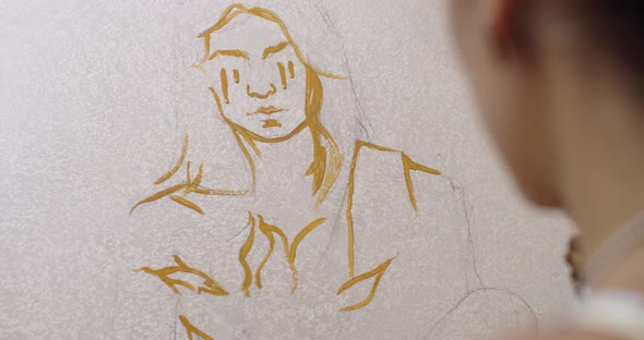 Detailed Macro View of Unrecognizable Artist Painting Female Portrait on White Paper Easel