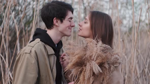 Portrait of Man and Woman Looking and Having Date in Reeds alt