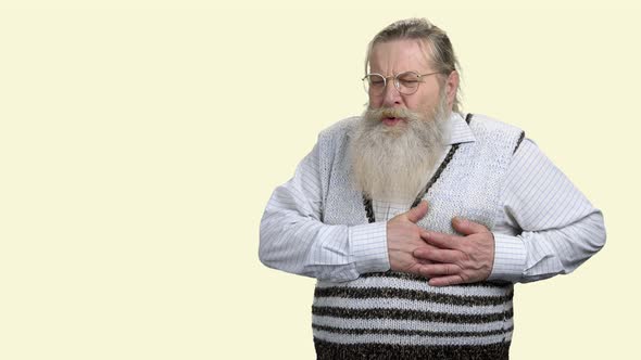 Senior Man Suffering From Heart Attack. alt
