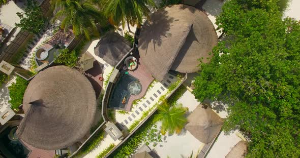 Aerial drone view of a couple at a spa resort hotel. alt