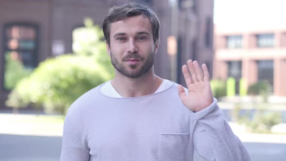 Hello Sign By Young Handsome Man alt